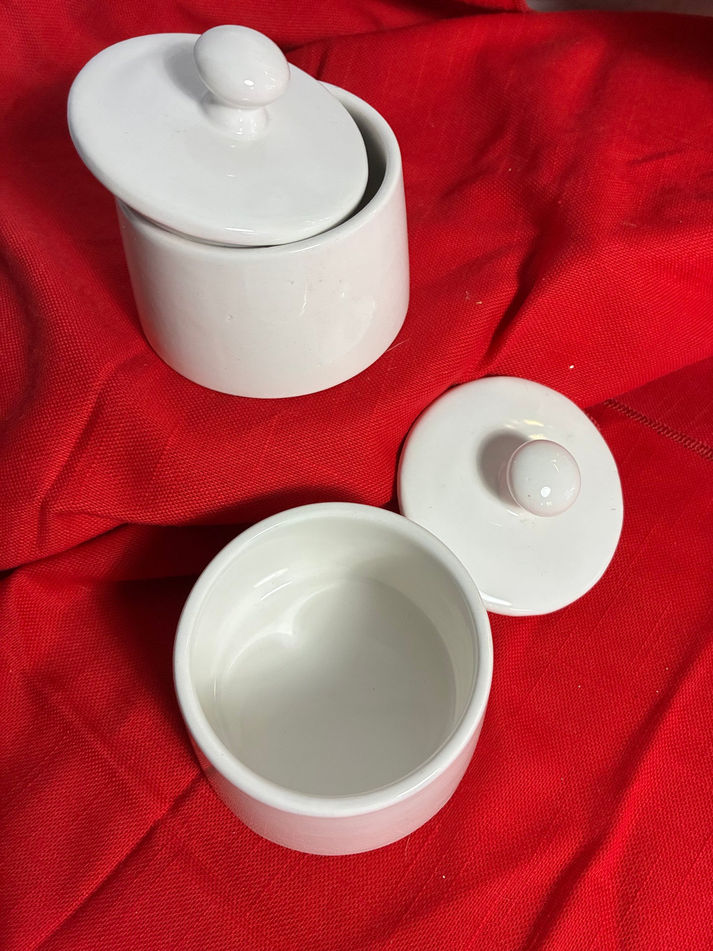 Pair of sleek white canisters