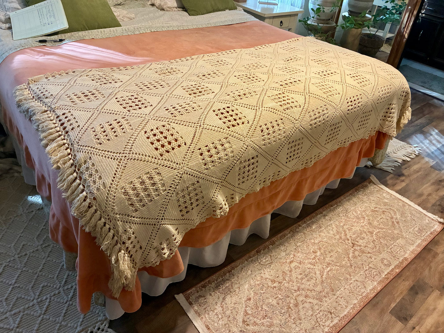 Crochet diamond pattern coverlet with fringe