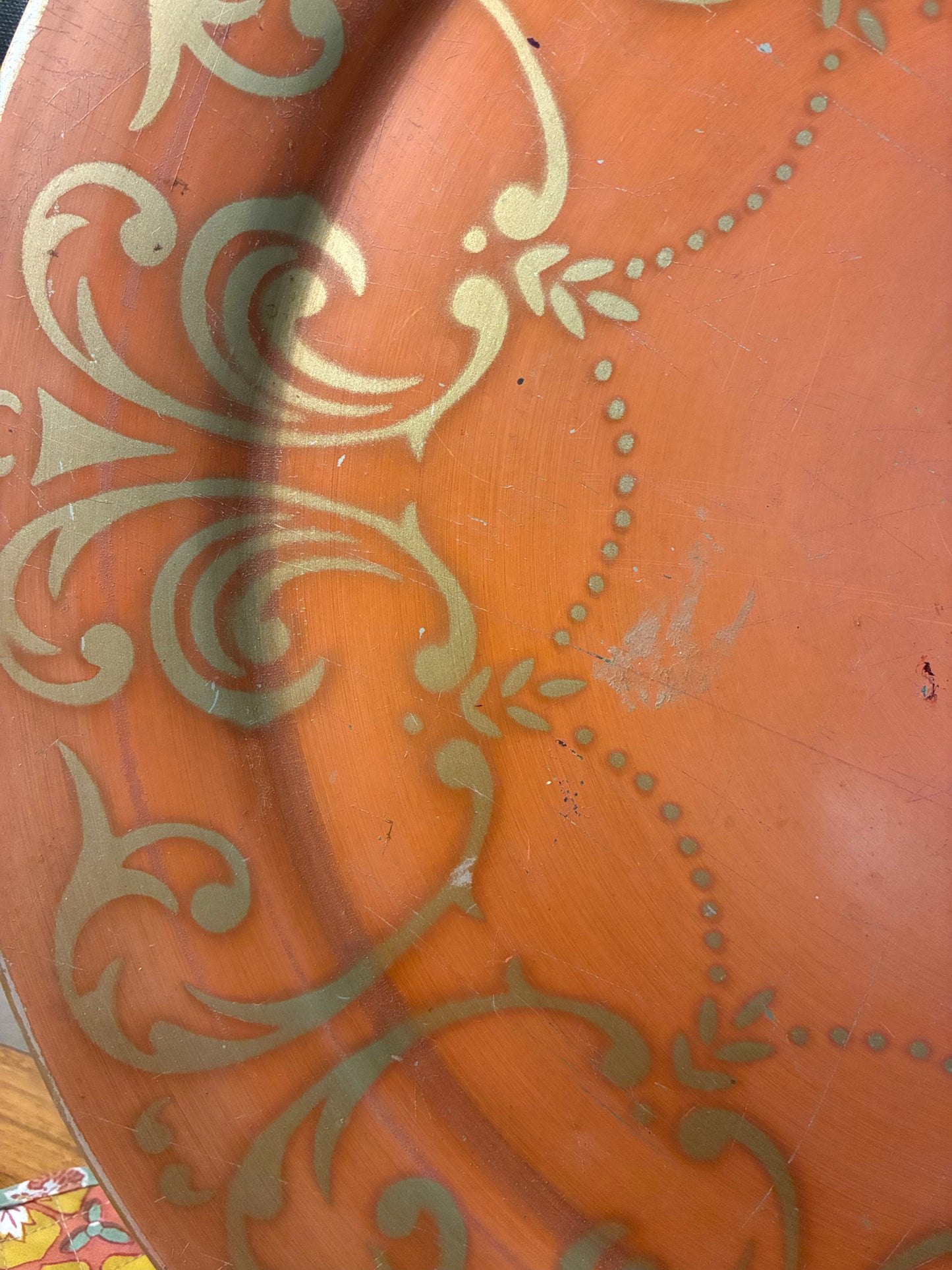 Vintage round metal tray with gold highlights